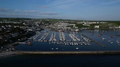 Brixham, South Devon, England: DRONE AERIAL VIEWS: The Outer Harbour and boats Stock Footage 241440978