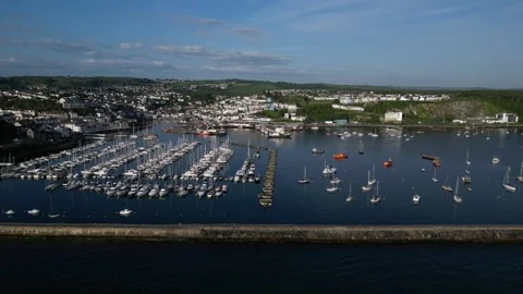 Brixham, South Devon, England: DRONE AERIAL VIEWS: The Outer Harbour and boats Stock Footage 241441033