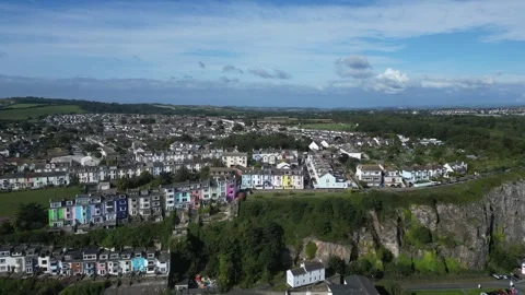 Brixham, South Devon, England: DRONE VIEWS: Pastel-coloured Victorian houses (2) Stock Footage 265004377