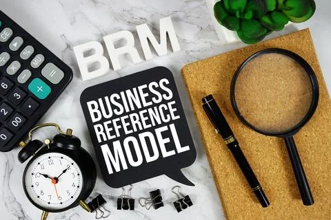 BRM - Business Reference Model acronym with calculator, alarm clock and mag.. Stock Photos