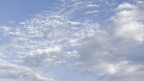 Broad Altocumulus Cloud Field Across Blue Sky Видео 344717347