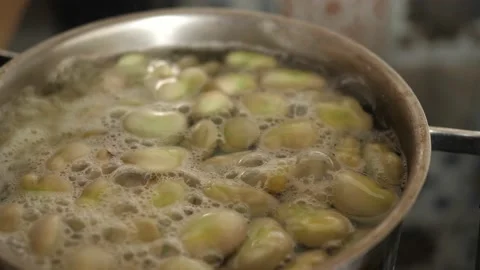 Broad beans are boiling in a pot Stock-Footage 136948606