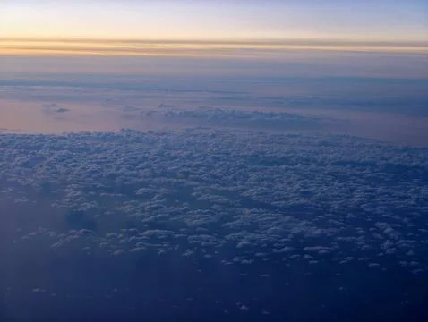 Broad cloud formation extends towards horizon with subtle twilight hues and.. 写真素材