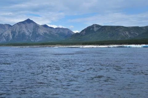 Broad mountain river. Stock Photos