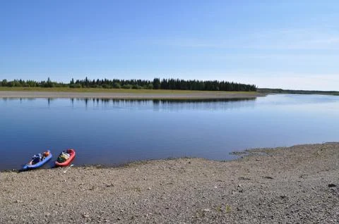 Broad river and the boat. Stock Photos