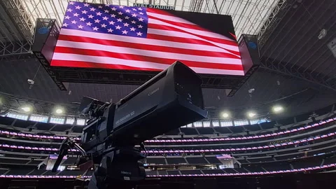 Broadcast camera inside AT&amp;T Stadium Dallas with USA flag preparing for FIFA Stock Footage 333049245