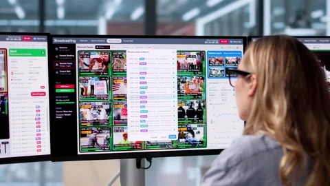Broadcast Engineer Carefully Monitors Live Production Stock Footage 347901864