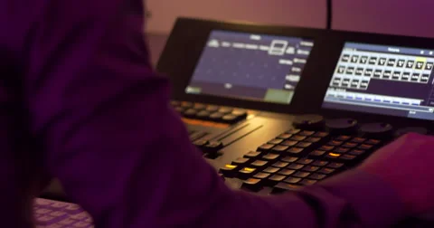 Broadcast light operator working with mixer Stock Footage 58313682
