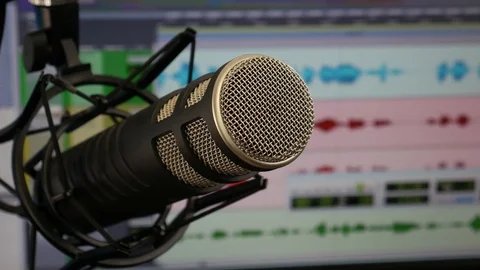 Broadcast Microphone in Shock Mount Close Up with DAW Playing Stock Footage