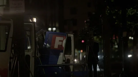 Broadcast Television News Camera Setup on City Sidewalk at Night Stock Footage 343094468