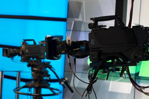 Broadcast television studio camera and crane camera in news studio room with  Stock Photos