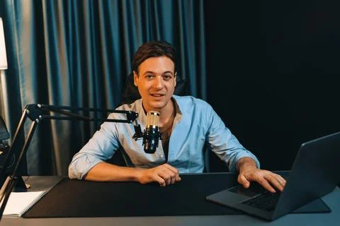 Broadcaster talking on live application searching on laptop. Pecuniary. Stock Photos