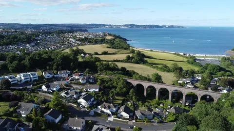 Broadsands, Devon, England: Drone View: Torbay sea, railway viaduct &amp; houses Stock Footage 201675831
