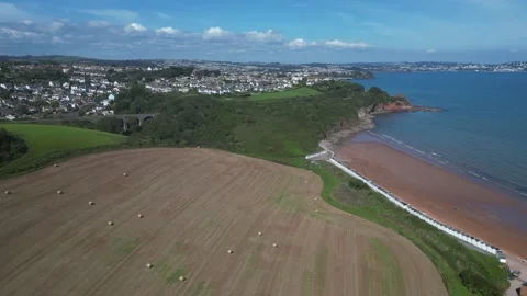 Broadsands, Devon, England: DRONE VIEWS: Hay bales and Broadsands beach Stock Footage 273566150