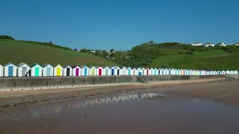 Broadsands, S. Devon, England: DRONE VIEWS: Beach huts &amp; reflection, sandy beach Stock Footage 241146073