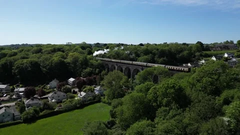 Broadsands, S. Devon, England: DRONE VIEWS: Steam train heads towards Kingswear Stock Footage 241727565