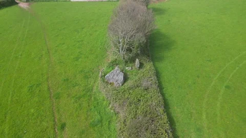 Broadsands, South Devon, England: DRONE VIEWS: A collapsed Neolithic tomb Stock Footage 239163757