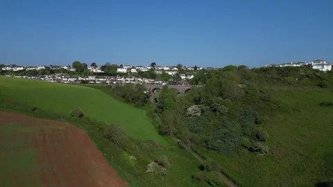 Broadsands, South Devon, England: DRONE VIEWS: Viaduct, beach huts &amp; sea Stock Footage 241145652