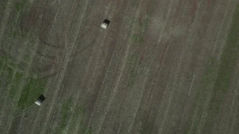 Broadsands, Torbay, Devon, England: DRONE VIEWS: Overhead shots of hay bales (1) Stock Footage 273565113
