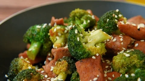 Broccoli and beef with ginger, soy sauce, sesame and olive oil Video stock 70458088