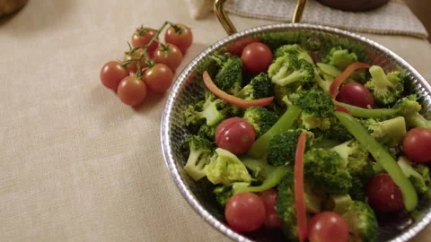 Broccoli and Cherry Tomato Vegetable Dish in Metal Pan on Table Setting Stock Footage 345217502