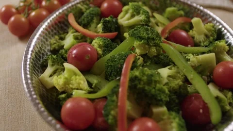 Broccoli and Cherry Tomato Vegetable Dish Served in Metal Bowl on Dining Table Stock Footage 345217924