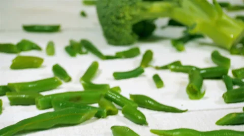 Broccoli and green beams on the white wooden table. Slider shot. Stock Footage 57530786