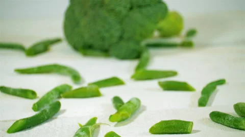 Broccoli and green beams on the white wooden table. Slider shot. Stock Footage 57531002