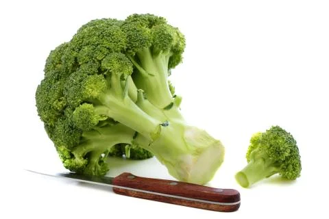 Broccoli and kitchen knife. Stock Photos