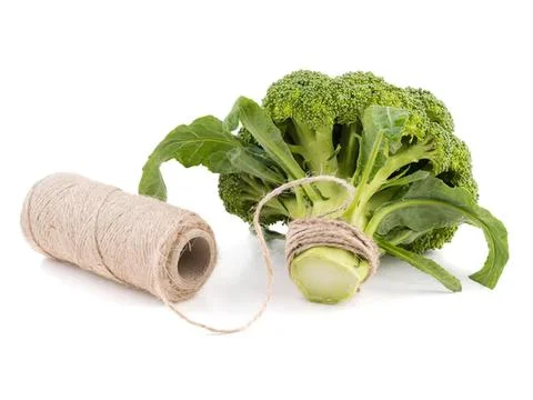 Broccoli and roll of string on white background Stock Photos