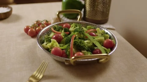 Broccoli and Tomato Salad Served in Metal Dish on Table with Fresh Ingredients Stock Footage 345277407