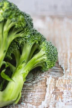 Broccoli are on the old table Stock Photos