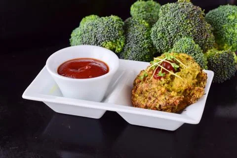 Broccoli balls deep fried with tomato sauce with fresh broccoli Stock Photos