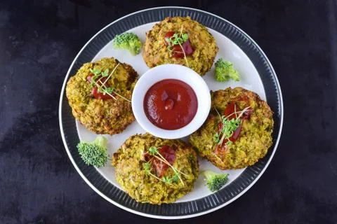 Broccoli balls deep fried with tomato sauce with fresh broccoli Stock Photos