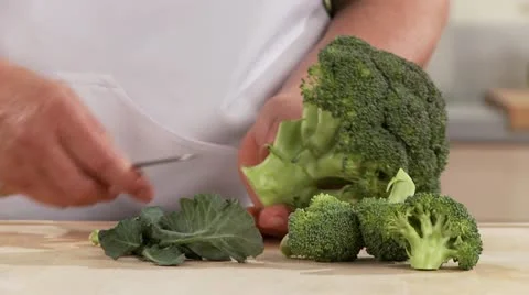 Broccoli being broken into florets Stock Footage 24634580