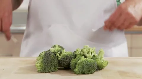 Broccoli being broken into florets Stock Footage 24634622