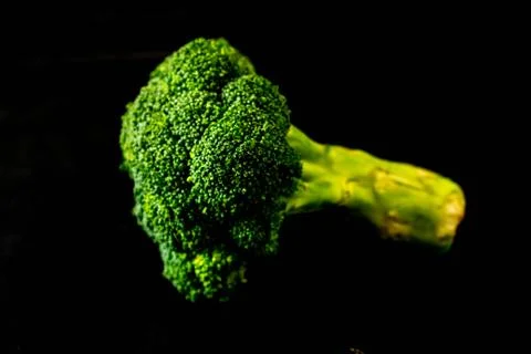 Broccoli on a black background isolated Stockfoto's