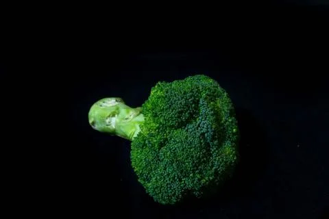 Broccoli on a black background isolated Stockfoto's