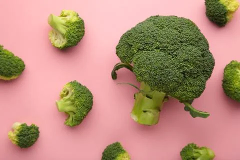 Broccoli cabbage on a pink background. Pattern of fresh broccoli cabbage. Stock Photos