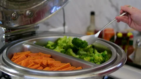 Broccoli carrots serving carrots in the buffet Closeup of a carrot vegetable on Stock Footage 313527202