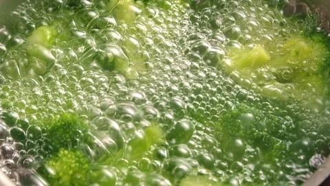 Broccoli is cooked in a pan in boiling water Stock Footage 113082867
