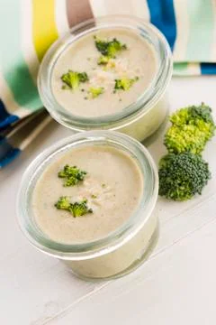 Broccoli cream soup on table Stock Photos
