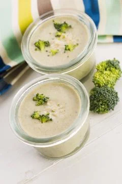 Broccoli cream soup on table Stock Photos