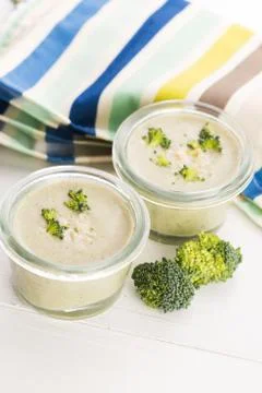 Broccoli cream soup on table Stock Photos