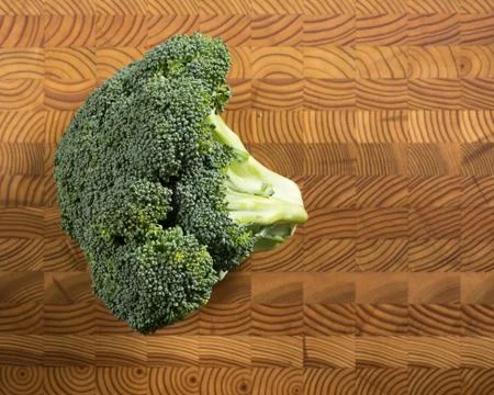 Broccoli on Cutting Board Stock Photos