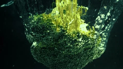 Broccoli Drops and Splashes in Water Stock Footage 300884699