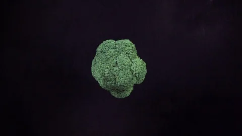 Broccoli falling on Black Surface and Slices Stock Footage 110871384
