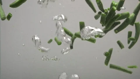 Broccoli falls into boiling water with string beans. Stock Footage 124520294