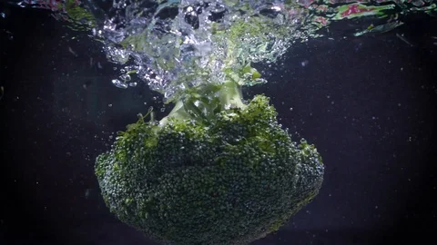 The broccoli falls into the water. Stock Footage 122982157