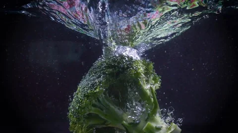 The broccoli falls into the water. Stock Footage 122982160